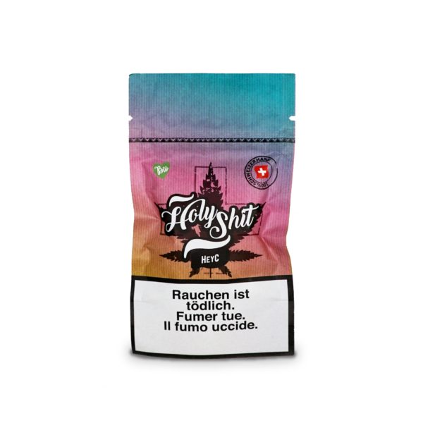 Regenbogenfarbene Verpackung der CBD-Marke 'Holy Shit' mit der Sorte 'heyC'